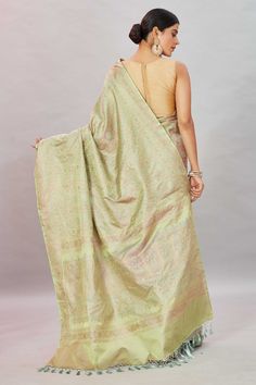 Look your ethnic best at weddings and special occasions in this beautiful Pistachio green Tanchoi Banarasi silk saree. It is enhanced with zari border and comes with a matching blouse piece. Disclaimer: The shown stitched blouse on the model is for display purpose only. The saree comes with a matching blouse piece and finished with fall and piko. Green Chikankari Pre-draped Saree For Diwali, Green Semi-stitched Pre-draped Saree With Meenakari, Green Pre-draped Tussar Silk Saree With Zari Weaving, Green Jamawar Pre-draped Saree For Festivals, Bollywood Style Green Meenakari Pre-draped Saree, Bollywood Green Meenakari Pre-draped Saree, Festive Green Jamawar Pre-draped Saree, Green Tussar Silk Saree With Meenakari, Green Meenakari Tussar Silk Saree