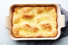 a casserole dish with some bread on top