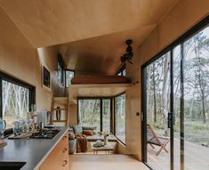 the kitchen and living room are separated by sliding glass doors