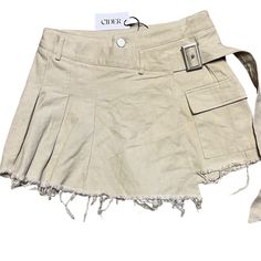 Cider Pleated Skort In Size L. Solid Beige Color, Short Length, Belt, Pockets, Frayed Edges, Buckle Closure. New With Tags. Keywords: Skirt, Skort Pleated, Regular, Short, Beige, Women, Solid, High-Quality Fabric, Belt, Pocket, Frayed Edges, Pleated, Pockets, Buckle, Casual, Cider, Skort, Boho, Size L. Brand: Cider Type: Skirt Size: L Style: Pleated Size Type: Regular Skirt Length: Short Color: Beige Department: Women Pattern: Solid Material: High-Quality Fabric Accents: Belt, Pocket, Frayed Edg Beige Pleated Mini Skirt, Belt Pocket, Solid Beige, Fabric Belt, Pleated Mini Skirt, Pocket Size, Beige Color, Skirt Length, Cider