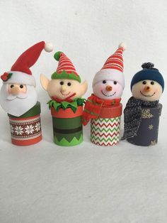 three snowmen are standing next to each other