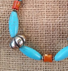 See More! www.etsy.com/shop/stonefoxarts The southwest and it's indigenous culture and art are close to my heart. My grandpa taught me jewelry making, and being from Arizona, that was his style of choice. I enjoy wearing and making southwestern style jewelry. This necklace features dyed teal howlite oblong oval focal beads at the central part of the necklace, the howlite is flanked by red coral beads that are up-cycled from a 1960s era vintage necklace, two up-cycled gold tone southwestern style Handmade Southwestern Beads For Jewelry Making, Artisan Turquoise Necklace With Large Beads As A Gift, Southwestern Turquoise Necklace With Spacer Beads, Southwestern Turquoise Beaded Necklace For Gift, Southwestern Turquoise Beaded Necklace As Gift, Turquoise Southwestern Beaded Necklace Gift, Turquoise Southwestern Beaded Necklace For Gift, Adjustable Southwestern Jewelry With Large Beads, Artisan Hand-strung Turquoise Necklace Gift