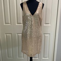 This Dress Is Sleeveless And Features A Deep V Neckline Front And Back, All Over Champagne Colored Sequined Detail In A Lightweight Fabric And Is Fully Lined. Perfect Party Dress For The Upcoming Holiday Season. Nwt. 34 1/2 Shoulder To Hem 19 Inches Pit To Pit E30 Summer Sleeveless Sequin Dress For Date Night, Spring Sleeveless Sequin Dress, Sleeveless Gold Mini Dress For Summer, Sequined Sleeveless Dress For Date Night In Spring, Sequined Sleeveless Dress For Spring Date Night, Spring Sleeveless Sequin Dress For Date Night, Gold Sleeveless Mini Dress For Spring, Gold Sleeveless Mini Dress For Summer, Gold Sleeveless Mini Dress For Date Night