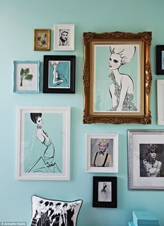 there are many framed pictures on the wall