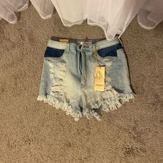 Never Worn Blue Denim Jean Shorts For Spring, Spring Blue Denim Jean Shorts, Ripped Denim Shorts In Blue, High Rise Blue Shorts With Frayed Hem, Blue High-rise Shorts With Frayed Hem, Trendy Distressed Blue Shorts, Blue High Rise Jean Shorts For Spring, High Rise Blue Jean Shorts For Spring, Blue High-waisted Jean Shorts For Spring