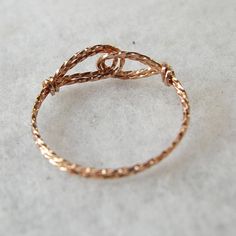 A fun and unique wirewrapped thumb ring made from twisted 14kt rose gold filled wire. The two interlocked swirls form a sort of infinity design, and the wire lays flat against your skin. Rose gold, or pink gold, is very fashionable these days! And I make this ring in a variety of sizes to fit everyone, no matter how big or small your finger may be! Twisted Wire Rings, Pink Gold Ring, Pink Gold Rings, Affordable Rings, Bracelet Set Silver, Infinity Design, Womens Ring, Wire Ring, Thumb Ring