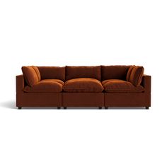 a brown couch sitting on top of a white floor