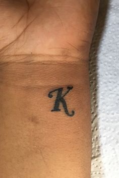 a person with a small tattoo on their wrist