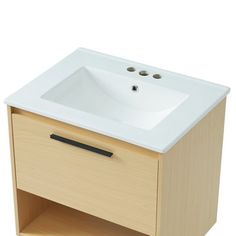 a white sink sitting on top of a wooden cabinet