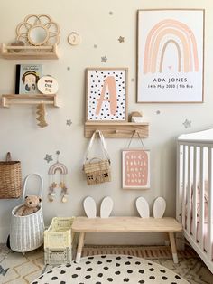 a baby's room with toys and decorations on the wall, including a crib