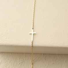 This beautiful, dainty cross bracelet is the perfect gift for a special women or young girl celebrating her first communion. Crafted from brilliant gold, this piece of cross jewelry will remind her of her each time she wears it. Can you imagine her joy when she opens the gift? Please note that we also offer matching Cross Pendant Necklace in our shop! Dainty 14k Gold Cross Necklace, Minimalist Gold Rosary Bracelet Gift, Gold Cross Bracelets For Everyday, Gold Cross Bracelet For Everyday Wear, Everyday Gold Cross Bracelets, Dainty Yellow Gold Rosary Bracelet As Gift, Yellow Gold Cross Bracelets As Gift, Adjustable Chain Cross Rosary Bracelet As Gift, Yellow Gold Cross Bracelet For Gift