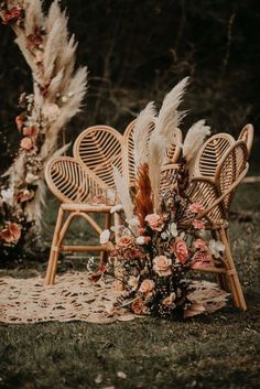 the chairs are decorated with flowers and feathers