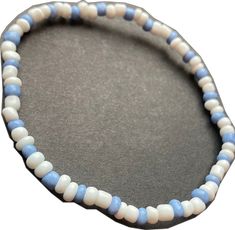 White Flexible Casual Bracelet, Casual White Flexible Bracelet, Casual Adjustable Beaded Bracelets With Spacer Beads, Casual White Stretch Bracelet With Large Beads, Casual Beaded Flexible Bracelet, Casual Flexible Beaded Bracelet, Casual Flexible Beaded Bracelets, Casual Blue Beaded Anklets, Casual Flexible Beaded Bracelets With Letter Beads