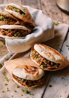 two pita breads with meat and vegetables on them