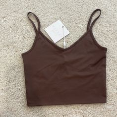 Meshki Willa V Neck Crop Cami Top Chocolate Brown New With Tags! Sold Out Online. Size Extra Small, Super Stretchy! Trendy Brown Camisole Top, Casual Brown Tops With Built-in Bra, Brown Top With Built-in Bra For Spring, Casual Brown Cami Crop Top, Trendy Brown Cami Top, Brown Tops With Built-in Bra For Spring, Brown Seamless V-neck Top, Casual Brown Crop Top With Built-in Bra, Casual Brown Camisole Top