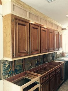 the cabinets are being installed in the kitchen