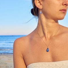 SODALITE CRYSTAL JEWELRY SET This delicate, teardrop Sodalite jewelry set is the epitome of understated beauty, making it the perfect gift for women any day of the year. The dainty blue stone necklace and earrings set is comprised of genuine indigo blue Sodalite stones. Choose either Sterling Silver 925 or 14K Gold fill as your finish. Also choose your necklace chain length: 16 inches, 18 inches or 20 inches. Please note that every Sodalite stone will vary in blue color and some will have white  striations, making each teardrop pendant beautifully unique.  The small and lightweight Sodalite stones are set in a lovely teardrop shape and are expertly wire wrapped by hand. The lightweight stone suspends 2 cm, about the height of a dime. The stone measures 1 cm at its widest point.  The chain Blue Gift Ideas, Girlfriend Jewelry Gift, Sodalite Jewelry, Blue Jewelry Set, Blue Stones Jewelry, Sodalite Necklace, Girlfriend Jewelry, Obsidian Necklace, Blue Stone Necklace