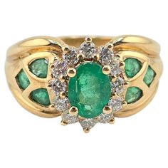 This is a fantastic 14 karat yellow gold ring with fabulous emeralds and diamonds. The emerald has a nice rich, vibrant green color, and the diamonds are all very clean and good color VS to SI quality. The weight of the ring is 6.01 grams and the ring size is size 6. The condition is excellent and it is ready to go, if you have any questions or any concerns, please ask Multi-stone Green Diamond Ring In 14k Gold, Green Multi-stone Diamond Ring In 14k Gold, Green Multi-stone 14k Gold Diamond Ring, Classic Green Multi-stone Emerald Ring, Luxury Green Diamond Ring Stamped 14k, Green Emerald Ring Stamped 14k Fine Jewelry, Fine Jewelry 14k Stamped Green Emerald Ring, Green Diamond Ring Stamped 14k For May Birthstone, Green Diamond Rings Stamped 14k