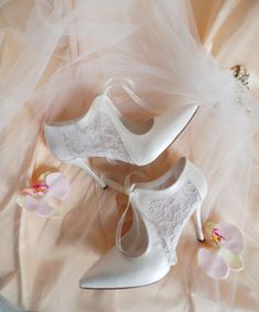 "These romantic bridal shoes feature sheer lace detailing and a vintage style lace-up for a truly unique look.  Handcrafted with floral tulle on the sides, to add a subtle touch of whimsy on your wedding dress.   These elegant heels are perfect for your wedding, but can also be styled on other occasions. Ivory floral tulle lace up wedding shoes for bride, custom heel heights available. Forever keepsake custom wedding gift, personalized wedding shoes. Custom details can be added on this design, the soles can be personalized with your names and wedding date. They are made of soft vegan leather and transparent lace, each handmade item is unique and can differ in details only slightly. Listing shoe style: 3 1/2\" (9cm) heels, closed toes, in ivory.  You can see similar tulle wedding shoes here Romantic Bridal Shoes, Lace Wedding Shoes, Wedding Shoes For Bride, Custom Heels, French Country Wedding, Wedding Wedges, Custom Wedding Shoes, Shoes For Bride, Wedding Shoes Vintage