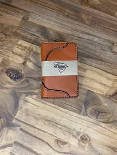 This is my Montana Western vertical wallet. My best seller it is shown in Chestnut and Tan 2 Toned. It measures 3.125 x 4.625 Closed Leather. Being a natural material, the shade of leather will vary with every wallet made. Brown Leather Wallet With Leather Patch, Brown Bifold Wallet With Leather Patch, Brown Bifold Wallet For Daily Use, Beige Leather Rectangular Card Holder, Rectangular Beige Leather Card Holder, Beige Rectangular Trifold Wallet With Card Slots, Everyday Brown Trifold Wallet, Artisan Brown Wallets With Interior Card Slots, Brown Leather Trifold Wallet With Waxed Finish