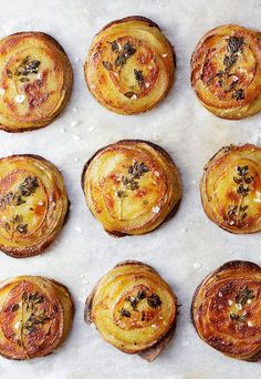 there are many small pastries on the baking sheet ready to be baked in the oven