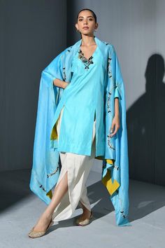 Blue slit sleeves cascading hem cape with nalki, pearls and jute floral embroidery. Paired with front slits, neckline embroidered kurta and plain dhoti pant.
Components: 3
Pattern: Embroidery
Type Of Work: Nalki, Pearls, Jute
Neckline: Kurta: V, Cape: Open
Sleeve Type: Kurta: Three Fourth, Cape: Slit Sleeves
Fabric: Pure Silk
Color: Blue
Other Details: 
Attached inner lining
Cascading hem cape
Front slits detail kurta
Weight: 1-2 kgs
Closure: Dhoti Pant: Elasticated
Occasion: Sangeet - Aza Fashi Floral Cape, Dhoti Pants, Open Sleeve, Pattern Embroidery, Silk Embroidery, Pant Set, Set For Women, Aza Fashion, Pure Silk