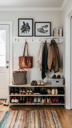 a coat rack with shoes and purses hanging on the wall next to a door