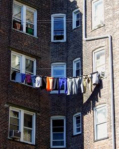 an apartment building with clothes hanging out to dry