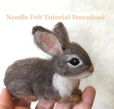 needle felt bunny sitting in the palm of someone's hand with text overlay