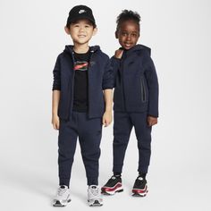 Made of bonded jersey knit fabric, this 2-piece set is inspired by the classic warmup suit. The hoodie has a full-zip closure that makes layering easy, and the matching tapered pants have ribbed cuffs and an elasticized waistband for a comfy fit little athletes can play freely in. Sporty Hooded Hoodie For Playwear, Nike Tracksuit For Sports, Nike Hooded Activewear For Jogging, Nike Tracksuit For Fall Sports, Nike Hooded Winter Tracksuit, Hooded Sportswear Outerwear For Jogging, Sporty Hoodie For Winter Playwear, Sporty Winter Hoodie For Playwear, Nike Hooded Tracksuit Athleisure