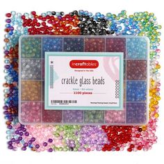 the craft kit is filled with colorful beads