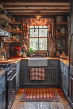 a kitchen with wooden floors and gray cabinets