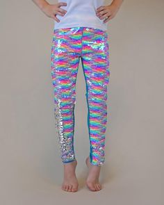 These fun, sequined pants are the perfect way to party in style! The cotton side provides breathable comfort, while the colorful reverse side is sequined flippin' fun!Front: 100% polyester Back: 100% cottonHand wash; hang dry Tight Pants For Spring Party, Stretch Multicolor Party Pants, Multicolor Stretch Pants For Party, Stretch Multicolor Pants For Party, Multicolor Sequined Bottoms For Party Season, Pink Party Leggings, Party Full-length Leggings, Pink Tight Leggings For Party, Multicolor Leggings For Spring Party