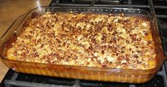 a casserole dish is sitting on top of the stove, ready to be eaten