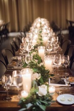 a long table is set with candles and flowers for a formal dinner or party event