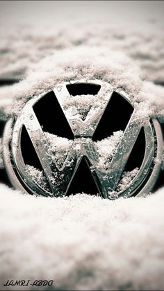 the vw emblem is covered in snow