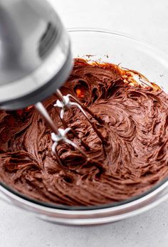 a mixer mixing chocolate in a bowl