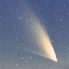 an image of a comet in the sky with stars on it's back ground