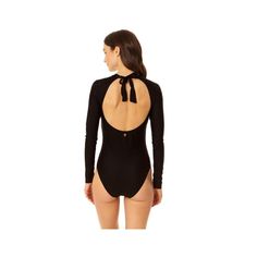 Our Coppersuit Long Sleeve One Piece swimsuit is the ultimate sleek rashguard for all your active days in the water. Our long sleeved rash guard provides extra coverage and UPF 50+ protection from the sun, while providing full range of motion. This stylish swimsuit is also designed with copper-infused fabric for antibacterial and odor-control properties to keep you feeling fresh all day long. An open-back tie detail and removable cups provide adjustable support and style. Hit the beach with this Fitted Long Sleeve Solid Swimwear, Solid Long Sleeve Beachwear Swimwear, High Stretch Long Sleeve Swimwear For Beach, High Stretch Long Sleeve Beach Swimwear, Solid Long Sleeve Rash Guard For Swimming, High Stretch Long Sleeve Swimwear For Surfing, Fitted Rash Guard With Thumbholes For Swimming, Upf 50+ Fitted Bodysuit For Poolside, Fitted Long Sleeve Swimwear For The Beach