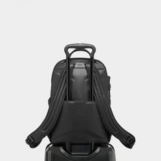 Tumi backpack is made of carbon fiber, leather, and polyester  Zip opening to main compartment Magnetic zipper pulls Zip entry to laptop compartment Luggage tag Top carry handle Add-a-Bag sleeve Built-in USB port  Two elastic open pockets Back open pocket; magnetic snap closure  Keyring Card pocket Two open pockets Padded tablet pocket TUMI Tracer® Approx. 9"L x 12"W Lining: Polyester Spot clean Imported Modern Laptop Bag With Anti-theft Pocket For On-the-go, Functional Travel Backpack For Business Trips, Luxury Backpack With Luggage Sleeve For Trips, Functional Leather Backpack With Zipper For Travel, Modern Travel Accessories Backpack With Zipper Pocket, Modern Travel Accessories With Functional Pockets, Modern Commuting Luggage Backpack, Modern Commuting Backpack Luggage, Modern Standard Backpack Luggage For Commuting