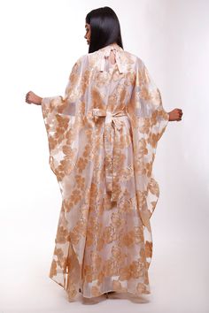 Turn heads in this mesmerizing floral Organza butterfly caftan dress, a true statement piece for the woman who loves to stand out. With its flowing butterfly sleeves and high neck design, this maxi-length beauty is perfect for black-tie events, luxurious resorts, or as an unforgettable wedding guest ensemble. Picture yourself twirling through a garden, or arriving at a fancy gathering with the vibrant floral gloss shimmering in the evening light. This dress is made for moments where elegance mee Elegant Floral Print Kaftan For Eid, Elegant Floral Print Kaftan For Festive Occasions, Elegant Spring Maxi Dress With Cape, Festive Maxi Dress With Cape Sleeves, Elegant Silk Floor-length Kaftan For Evening, Luxury Festive Maxi Dress, Silk Maxi Kaftan For Evening, Silk Maxi Length Kaftan For Evening, Elegant Floral Print Maxi Dress For Eid