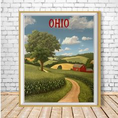 a poster with the word ohio on it in front of a brick wall and wooden floor