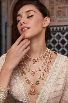 Indulge in the allure of timeless beauty with our exquisite Pink layered kundan necklace. Handcrafted with care, the lustrous Kundan stones, with their captivating hue, create a harmonious blend of heritage and sophistication. This ethnic Indian Rani Haar necklace is a tribute to timeless elegance and Indian royalty.  Mystical floral accents captivate, while shell pearls whisper like the sea.  Closure - Adjustable Dori Handcrafted in Jammu and Kashmir Paisley Pop travels the depths of India to learn techniques and crafts from deep down in the local markets and villages. We give utmost importance to our quality and packaging. Our goal is to ensure you receive exactly what you are looking for and for your experience to be special and memorable. We are ready to help and advise you through you Indian Pearl Necklace, Indian Royalty, Royal Indian, Rani Haar, Layered Pearl Necklace, Pink Pearl Necklace, Antique Jewelry Indian, Kundan Necklace, Jammu And Kashmir