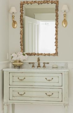 a bathroom vanity with an ornate mirror above it and the caption reads, before everything about this