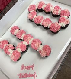 a birthday cake with pink and white frosting in the shape of the number 50