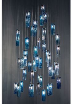 a chandelier with blue glass blocks hanging from it