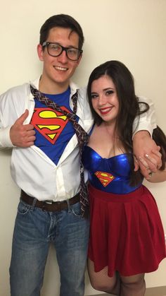 a man and woman dressed up as superman and wondergirl posing for the camera with their arms around each other