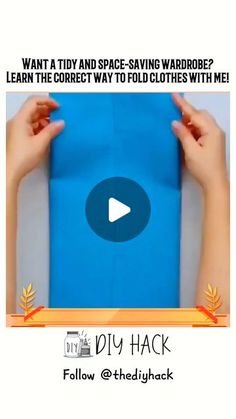 two hands holding up a blue piece of paper with the text, want a tidy and space saving wardrobe? learn the correct way to fold clothes with me