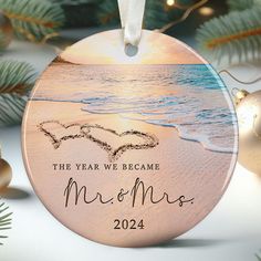 a personalized ornament for the year we become mr and mrs on a beach