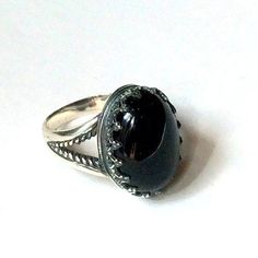 "My first love Amazing silver ring. A great combination of the deep black onyx set in the oxidized silver bezel. (R2058). © 2011-2015, Artisanimpact Inc. All rights reserved. Construction & Dimensions: Sterling silver, onyx. Approximate band width: 3mm - 10mm Top part of the ring 15mm (0.59\") x20mm (0.78\"). We can make any size, including quarter sizes. Please just indicate the requested size in the order. About our jewelry Artisanlook offers an exciting collection, designed and made by ar Fantasy Garb, Ring Crown, My First Love, Gemstone Ring Silver, Bohemian Ring, Ring Birthstone, Meditation Rings, Gold And Silver Rings, Silver Crown